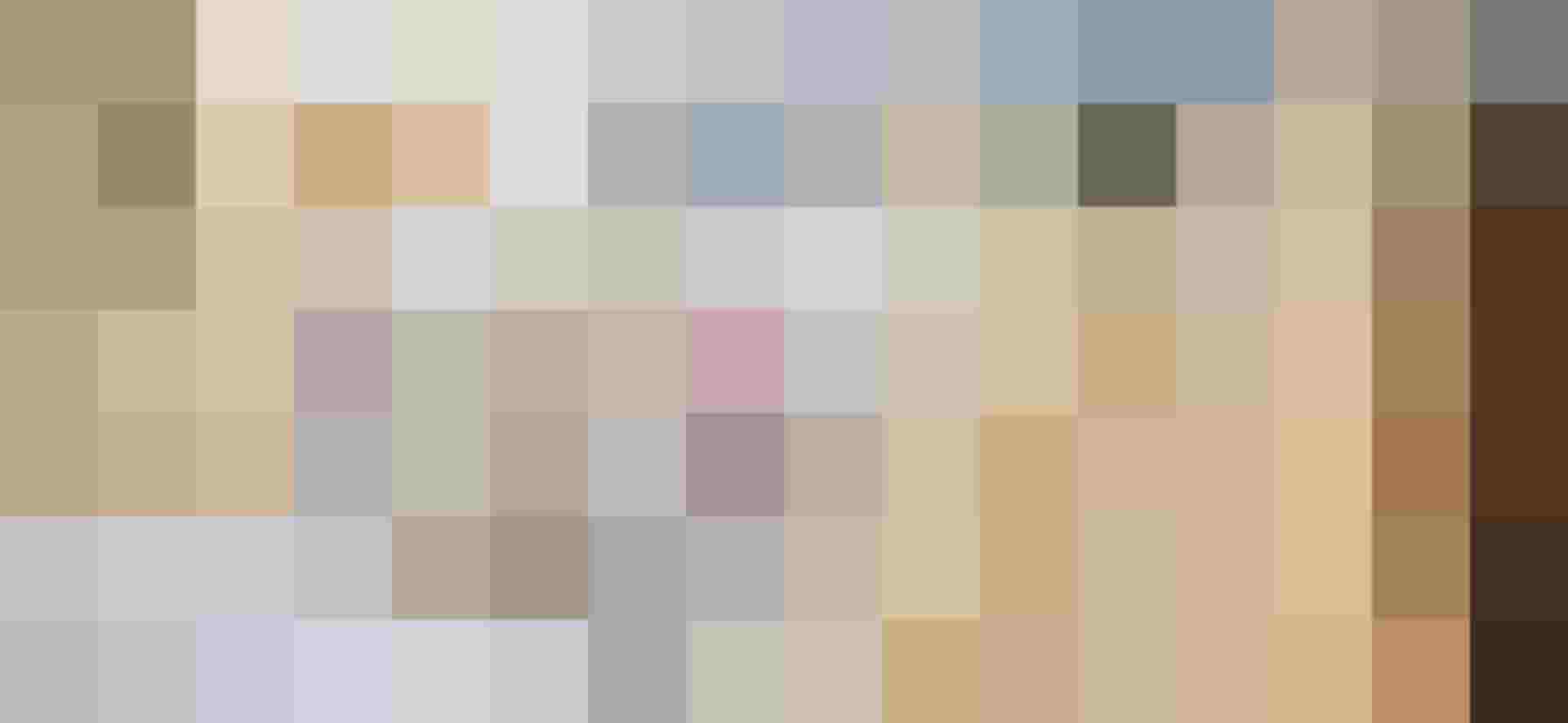 Gemütliches Gästezimmer mit liebevoll dekorierten Kissen in der Pension Monika in Kaprun